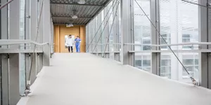 medical team walking down hallway at the hospital